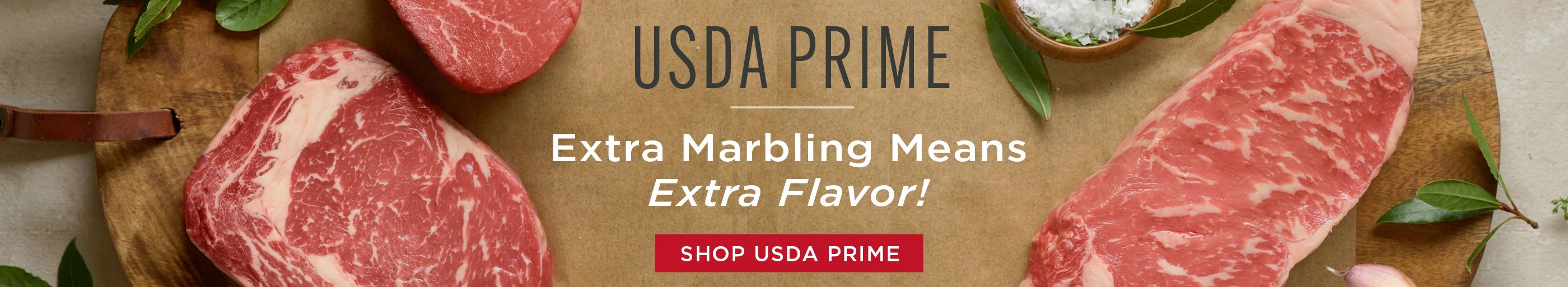 USDA Prime steaks spread on cutting board.