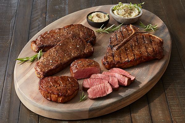 Various steak cuts on cutting board