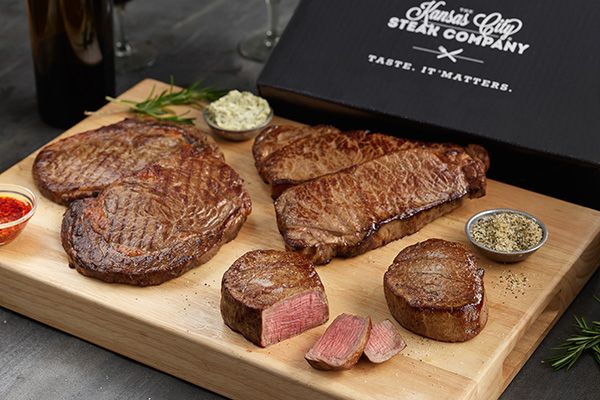Gift Boxed Steaks with butter on cutting board